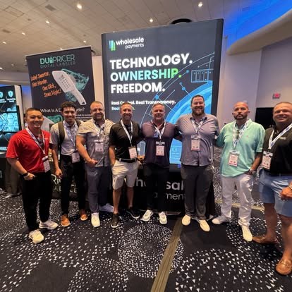 Wholesale Payments team at an industry event booth